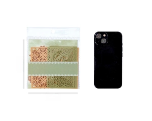 Lace-style hollow decorative paper for DIY scrapbooking shown next to a smartphone for scale