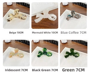 Various acetate bow hair claws in marble and iridescent finishes with sizes 7cm and 10cm