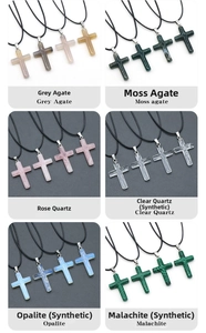 Macro detail of various polished crystal cross pendants with woven black cords and metal clasps
