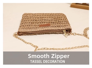 Detail view of the khaki straw woven bag showing smooth metal zipper and premium texture