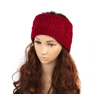 Close-up of wine red cable knit texture on a wide winter thermal headband