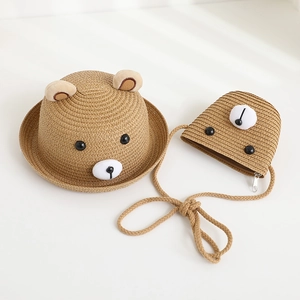 Detail of cute bear-themed straw sun hat and matching crossbody bag for children