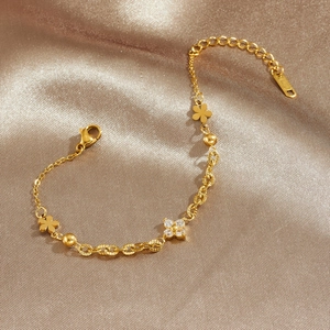 Elegant gold clover bracelet with sparkling diamonds and polished bead chain for women