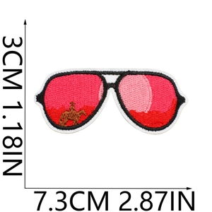 Close-up of pink sunglasses embroidery patch showing detailed dimensions and stitching