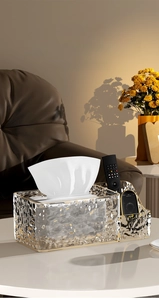 Detail of luxury glacier texture tissue box with gold rim and remote control storage