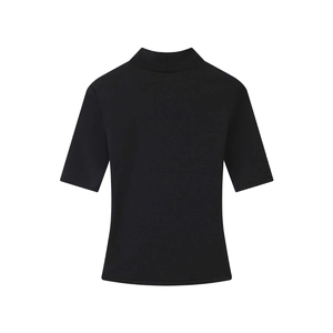 Detail of black mock neck short sleeve knit top with slim fit silhouette and fine texture