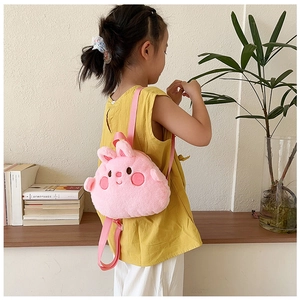 Pink plush rabbit backpack for toddlers with adjustable straps shown in daily use