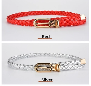 Detail view of red and silver braided skinny belts with golden U-shaped metal buckles