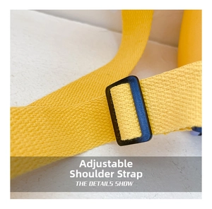 Detail showing adjustable yellow nylon woven shoulder strap with black buckle for kids bag