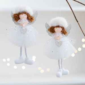 Macro shot of white mesh angel doll hanging ornament with silver wings and a sequined heart