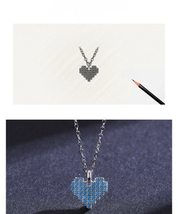 Detail of pixel heart pendant necklace with turquoise inlay and design sketch
