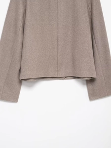 Detail of premium wool blend jacket texture with high-quality stitching and fabric