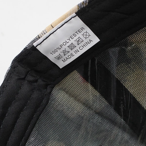 Detail view of the 100% polyester baseball cap inner lining and care label information