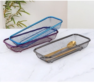Modern rectangular metal mesh organizers in blue, purple, and black on marble surface