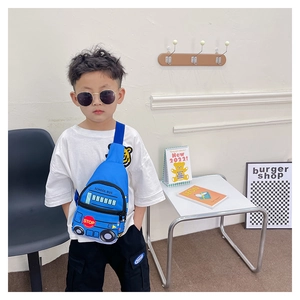 Child wearing blue school bus chest bag with adjustable black strap and yellow prints