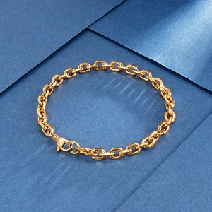 Detail view of a gold-toned stainless steel O-chain bracelet with a lobster clasp