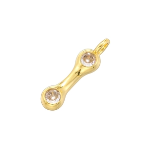 Close-up of 18K gold plated bamboo-style letter pendant with clear round gemstones