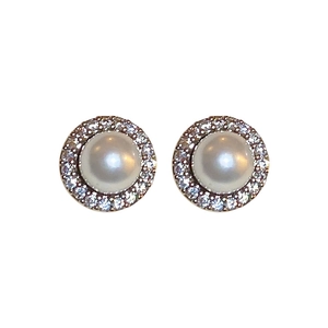 Elegant round pearl earrings with zircon halo and silver needle in minimalist style