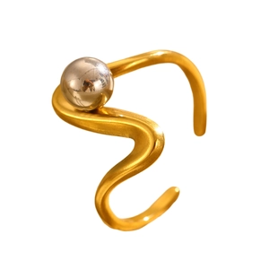 Close-up of wavy gold and silver two-tone stainless steel ring with polished finish