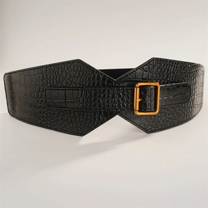 Detail of wide black elastic belt with crocodile texture and gold square buckle