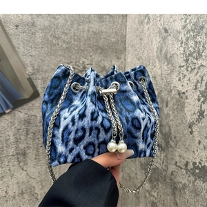 Blue and black leopard print bucket bag with silver chain and pearl drawstring accents