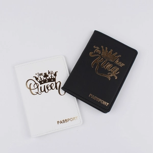 Detail of His and Her King and Queen gold printed faux leather passport covers