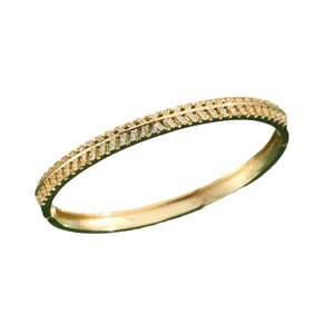 Elegant gold oval bangle with symmetric hollow design and inlaid white cubic zirconia stones