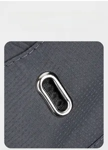 Detail of dark grey ripstop fabric with metal ventilation eyelet for breathable sun hat