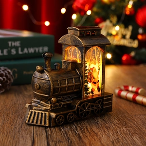 Détail d'une lanterne train Père Noël en bronze avec éclairage LED chaud et festif