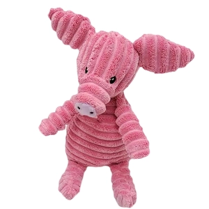 Pink corduroy pig plush squeaky toy for dogs with durable bite-resistant fabric texture