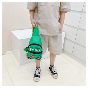 Detailed view of kids school bus chest bag in green worn by a model for size scale