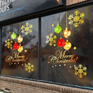Golden snowflakes and colorful Christmas ball static stickers on glass window display