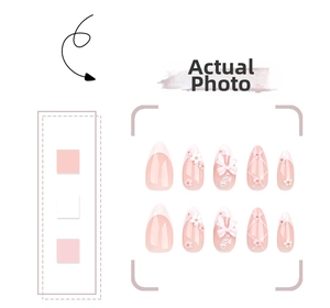 Detail of pink bow and 3D flower press-on nails with white French gradient tips