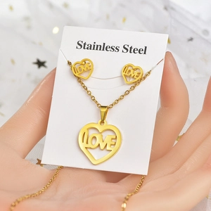 Golden stainless steel heart jewelry set with Love engraving necklace and earrings