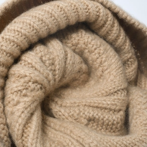 Thick jacquard knit winter hat in camel featuring premium cable texture for warmth