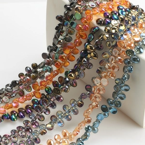 Macro shot of colorful moon-shaped crystal pendants for DIY jewelry crafting