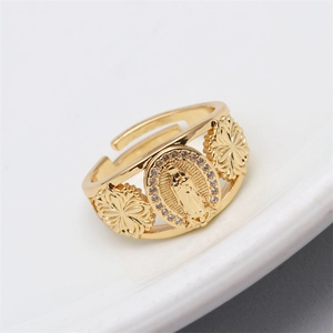 Detail of gold open ring featuring Virgin of Guadalupe relief and sparkling zircon inlay