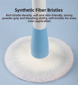 Macro view showing the soft synthetic bristles and dense texture of the blue powder brush