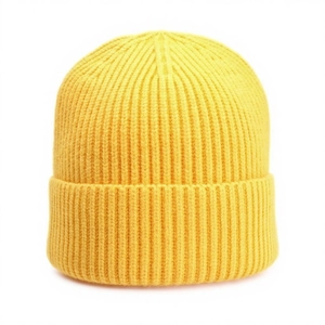 Macro shot of bright yellow ribbed knit beanie showing thick texture and folded cuff