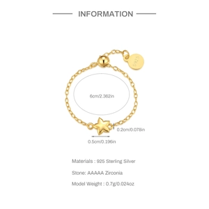 Detailed view of gold S925 sterling silver chain ring with star pendant and zircon stones