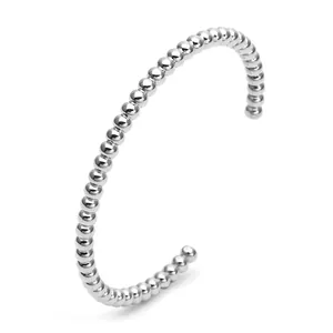 Minimalist silver stainless steel C-shaped beaded open bangle bracelet on white background