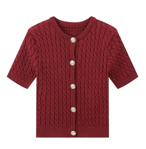 Close-up of wine red short sleeve cable knit cardigan with silver metal buttons