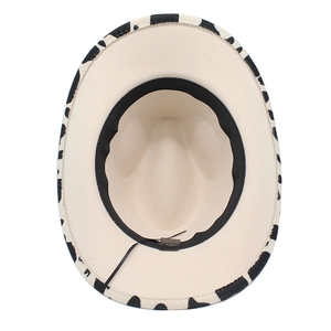 Detail of cow print western hat featuring inner sweatband and adjustable drawstring