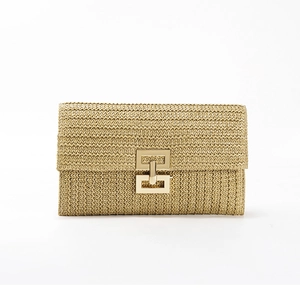 Chic woven straw clutch with a geometric gold metal clasp for spring and summer