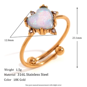 Detail of 18K gold-plated stainless steel ring with pink opal heart and side crystals