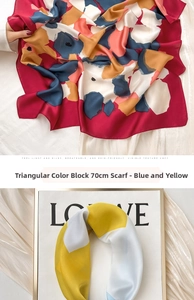 Detail of silk square scarf featuring vibrant floral and geometric patterns