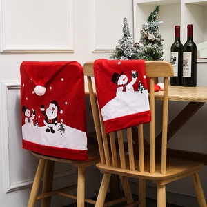 Red felt Christmas chair covers with Santa and Snowman patterns for festive dining decor