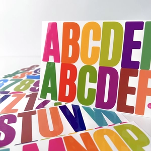 Macro shot of colorful self-adhesive waterproof vinyl letter and number stickers