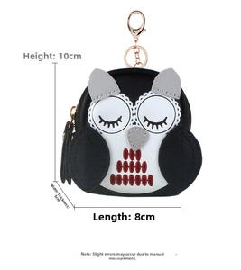 Detailed dimensions of owl coin purse showing 10cm height and 8cm length with gold clasp