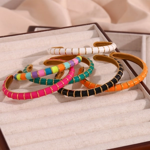 Stack of 18K gold-plated stainless steel enamel open bangles in six vibrant colors